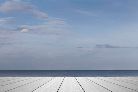 Wood perspective on sea image background. Empty top of wooden table. wood table top on blurred blue seaの写真素材