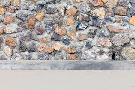 Brown natural stone concrete wall at the beachの写真素材