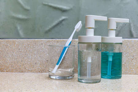 Clear plastic bottles for shampoo and body wash in the showerの写真素材
