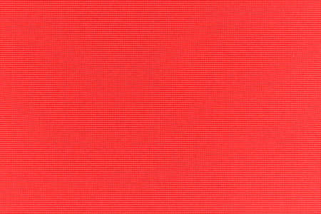 Red canvas texture background of cotton burlap natural fabric cloth for wallpaper and painting design backdropの写真素材