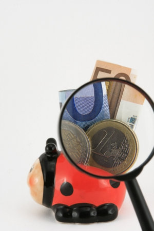 photo of piggy bank full of euros on a white backgroundの写真素材