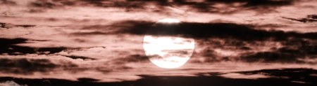 Panoramic image of the sun between the clouds