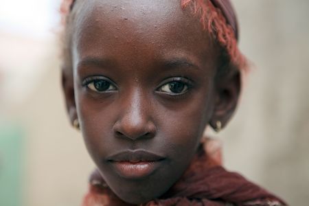 Mopti,Mali - August 16,2009 : African girl posing, children flooded the streets of Mopti looking for tourists to get any gift.のeditorial素材