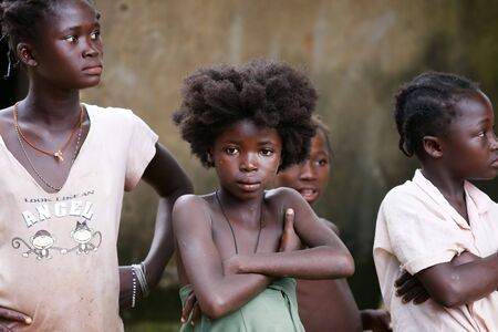 Gaoua,Burkina Faso - August 12 : Girls of the Lobi ethnic group, the Lobi maintain their ancestral customs, hardworking women and men protecting the village.のeditorial素材