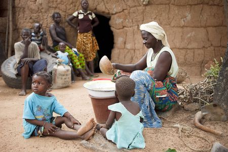 Gaoua,Burkina Faso - August 12,2009 : Women Lobi separating the grain, women are responsible for handling all foods.のeditorial素材