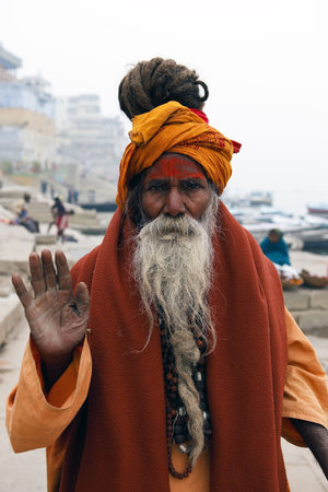 Varanasi,India - January 2,2010 : Sadhu in the river Ganges, a sadhu renunciation of all ties that...