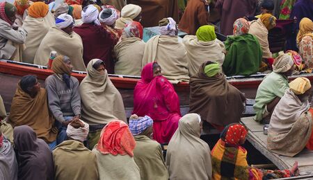Varanasi,India - January 2,2010 : boats full of people, thousands of people arrive and leave each day by the river Ganges in Varanasi.のeditorial素材