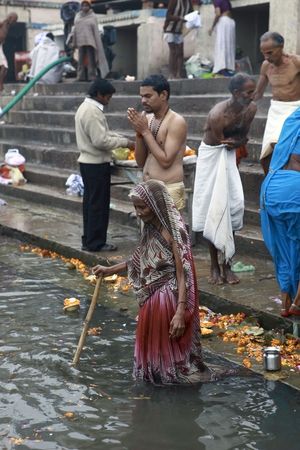 INDIA, JANUARY 1: Scene bathing in the river Ganges, thousands of people of all ages and castes flock daily to the ritual of bathing in the Ganges, January 1, 2010 in Varanasi, Indiaのeditorial素材