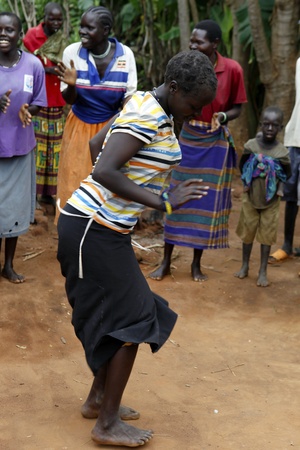 UGANDA-AUGUST 12: Karamojong ethnic woman dancing,live in northeastern Uganda, is currently in the process of disarmament, August 12, 2010 in Karamoja, Uganda のeditorial素材