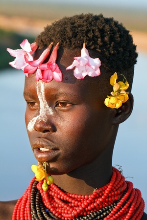 omo walley, ethiopia, august 13, 2011 - women of ethnic karo, karo women decorate their bodies with paintings and flowers.のeditorial素材