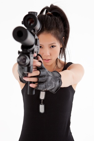Asian woman with gunの写真素材