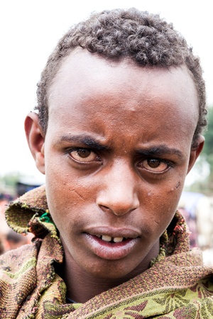 gasena, ethiopia, august 2, 2011: young ethiopian posing, gasena weekly market brings together various ethnic groups in the north to exchange or sell their products.のeditorial素材