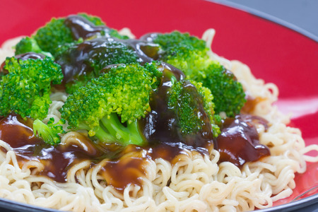 Broccoli with noodles and oyster sauceの写真素材