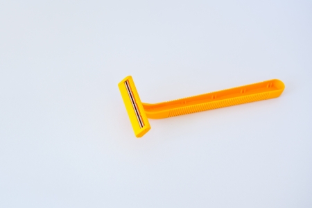 yellow shaver on white background の写真素材