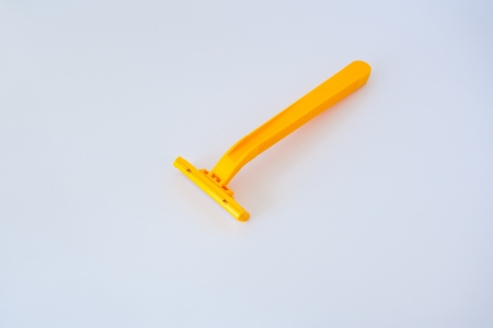 yellow shaver on white background の写真素材