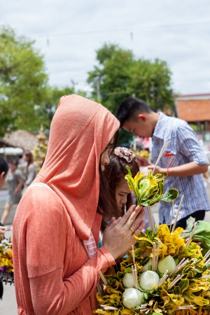 Chiang Mai Thailand June 13 identified woman Pay homage to a Buddha with flowers.のeditorial素材
