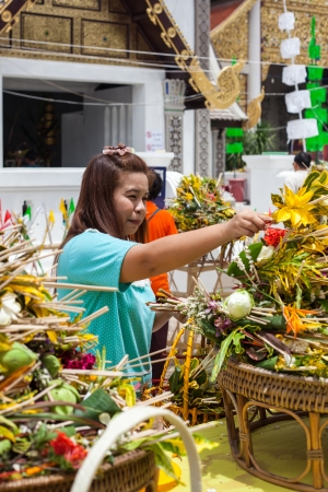 Chiang Mai Thailand June 13 identified woman Pay homage to a Buddha with flowers.のeditorial素材