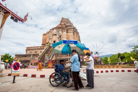 Chiang Mai Thailand June 13 identified People pay homage to a Buddha with flowers.のeditorial素材
