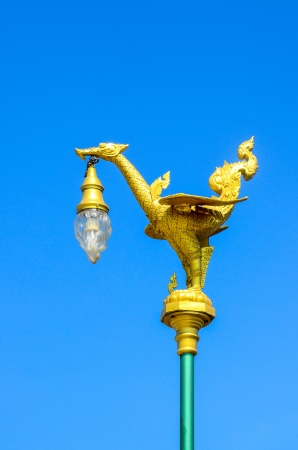 Golden swan lamp, made form Thai art traditional style easy to find beside the important streets in Thailandの写真素材