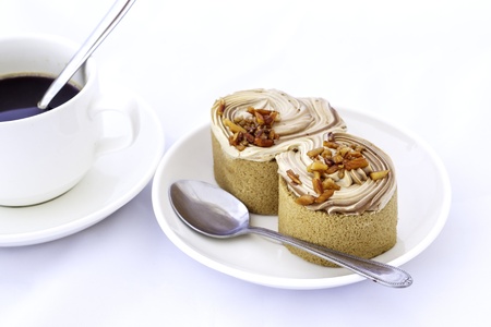 cup of coffee and delicious cake on white backgroundの写真素材