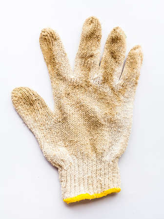 Old gloves  on white backgroundの写真素材