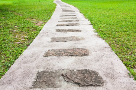 Stepping Stone Path in a Beautiful Green Gardenの写真素材