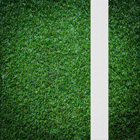 White stripe on the green soccer field from top viewの写真素材