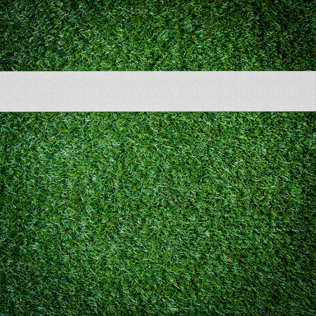 White stripe on the green soccer field from top viewの写真素材