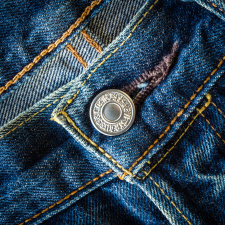 CHIANG MAI, THAILAND- FEBRUARY 15, 2015: Close up detail of button of the LEVI'S denim jeans. LEVI'S is a brand name of Levi Strauss and Co, founded in 1853.のeditorial素材