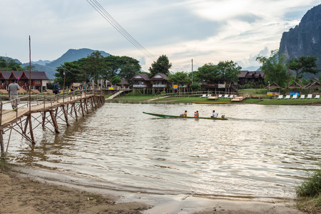 VANG VIENG, LAO P.D.R. - October 24 : Unidentified tourists are rowing kayak boats in Song River on October 24, 2014 in Vang Vieng, Lao P.D.R.のeditorial素材