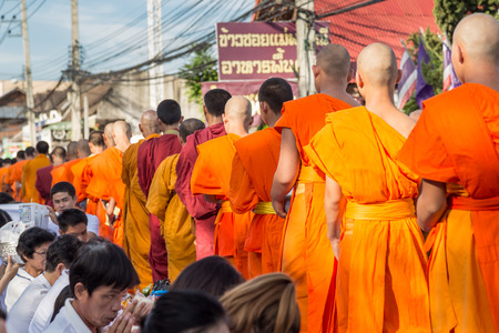 CHIANG MAI, THAILAND - May 31 : Many people give food and drink for alms to 1,536 Buddhist monks in visakha bucha day on May 31, 2015 in Chiang Mai, Thailand.のeditorial素材