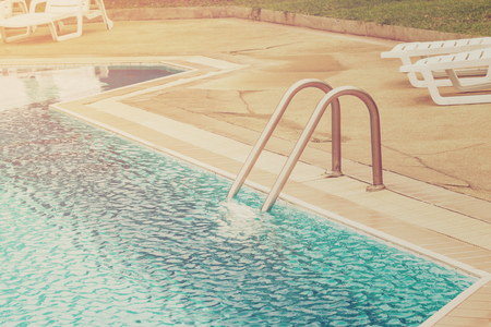 Swimming pool with stairs with vintage effect.のeditorial素材