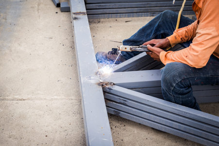 Close hand man arc welding or stick welding iron