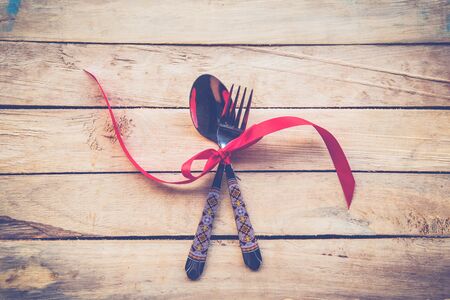 Valentines dinner on wooden background with space. Vintage style.の写真素材