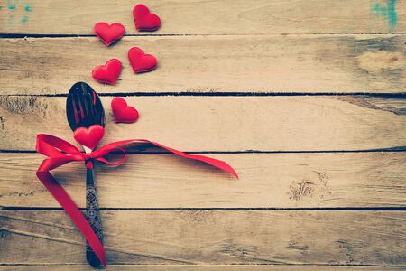 Valentines day dinner with table setting in rustic woodの写真素材