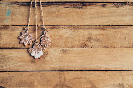 Christmas decoration hanging on wood background texture with copy space.の写真素材