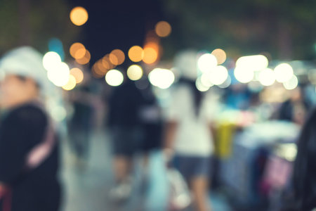 People walking at Festival Event Party and bokeh Blurred Background.の写真素材