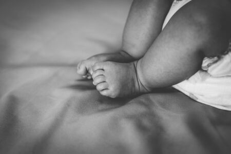 Close up newborn baby legの写真素材