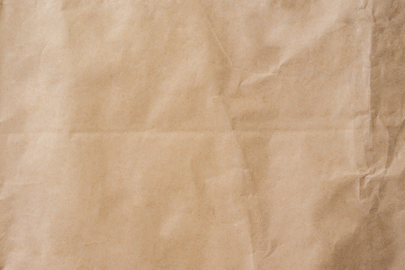 Brown paper crumpled texture and background with space.の写真素材