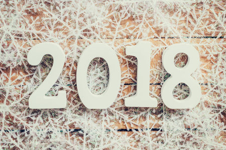 Wooden brown New Year 2018, christmas background and snowflakes with space.