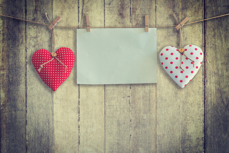 Heart and paper hanging on wood Background and Texture, Vintage toned.の写真素材