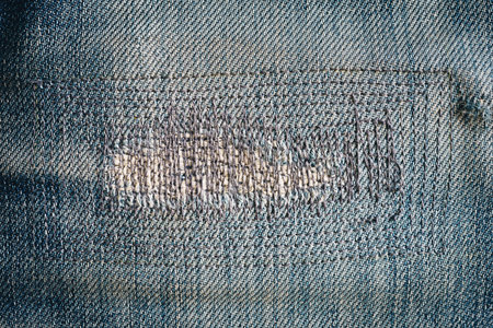 close up patch old jeans denim texture and background.