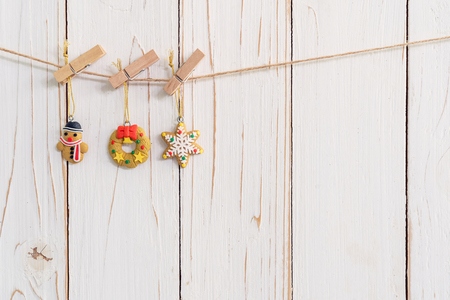 Ornamental christmas decoration hanging on wooden for christmas background with spaceの写真素材