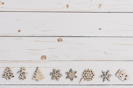 Wooden white and christmas background with snowflakes and christmas decoration.の写真素材
