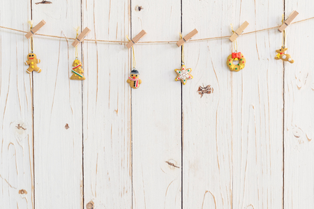 Ornamental christmas decoration hanging on wooden for christmas background with spaceの写真素材