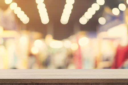 Empty wooden table top and Blur image background with space display montage for product.の写真素材