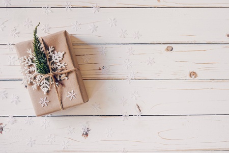 Brown gift box and Christmas presents on white wooden table background.の写真素材