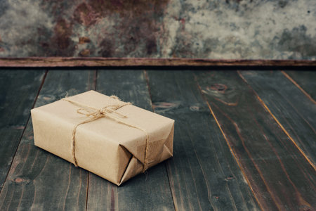 brown gift box on wooden table background with copy space.の写真素材