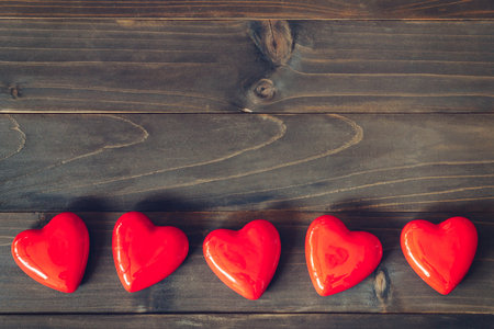 red heart on wood table background with copy spaceの写真素材