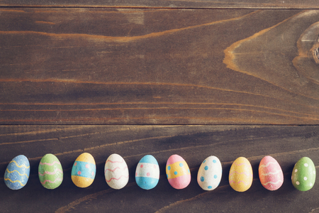 Top view of Easter eggs on rustic wood background with copy spaceの写真素材